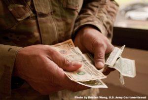 Servicemember counting money